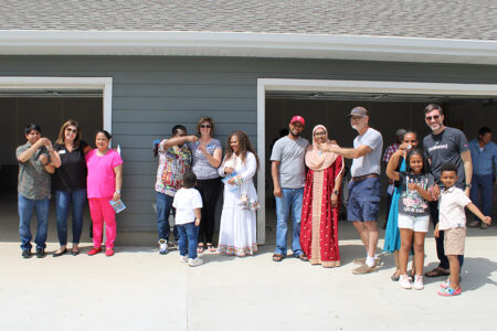 four families are presented with keys at their home dedications