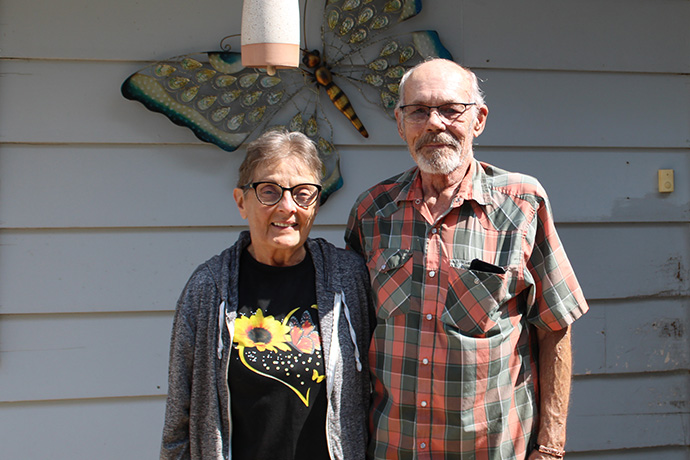 Homeowners Chuck (veteran) and JoAnn stand in front of their home.