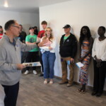 CTE Academy's assistant principal said a few words. CTE's assistant principle congratulates Rebecca on the purchase of her new home.