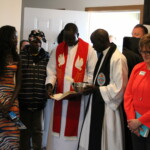 Two of Rebecca's faith leaders bless the home