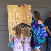 Dalonda places her key on a sign with 200 other keys on it.