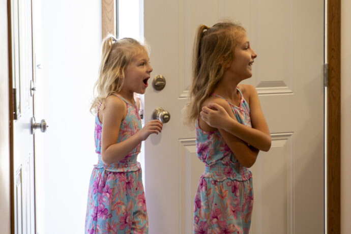 Dalonda's daughters walk into the home with looks of excitement and surprise.