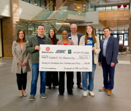 Thank you to The First National Bank in Sioux Falls and Federal Home Loan Bank of Des Moines for awarding us a $36,750 Member Impact Fund grant! Habitat for Humanity and FNBSF team members smile while holding a giant check for $36,750.