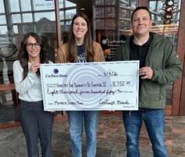 Thank you to CorTrust Bank and Federal Home Loan Bank of Des Moines for awarding us an $8,750 Member Impact Fund grant! Habitat for Humanity and CorTrust Bank team members smile while holding a giant check for $8,750.