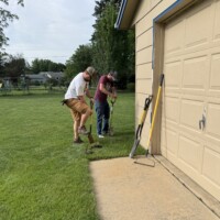 We started off Thursday morning with a little digging for a landscaping project. Habitat's NR coordinator and a volunteer dig into the grass around a garage.