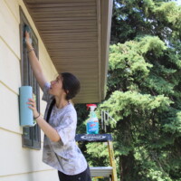 A few more windows got washed to finish up our amazing week of revitalization in the Kingswood neighborhood! A volunteer washes exterior windows.