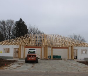 Photo of a Habitat twin home in November 2022. ICF blocks and roof trusses are set and visible.