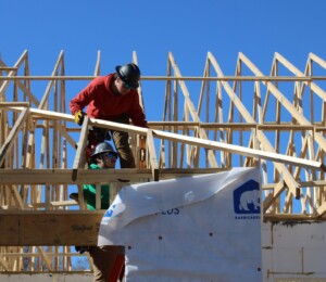 Students from Southeast Technical College set roof trusses on a Millard Acres twin home.