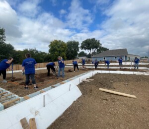 A wide shot of the foundations in Millard Acres on the last day of Women Build 2023 in Millard Acres.