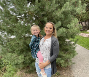 Dana and her daughter smile for their Habitat family photo.