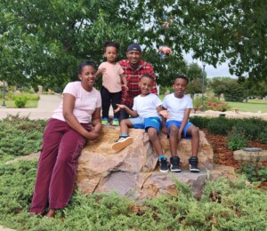 Family photo of Francoise, Reverend and their three children